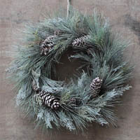 frost holiday wreath decor with pine cones